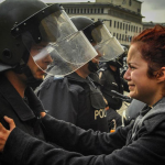 14.-Sofia-Bulgaria-2013-Riot-police-and-protesters-share-a-cry-together.png