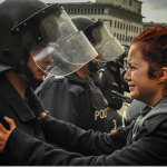 14.-Sofia-Bulgaria-2013-Riot-police-and-protesters-share-a-cry-together_thumb.png