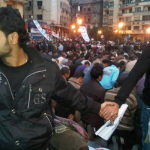 15.-Cairo-Egypt-2011-Christians-protecting-Muslims-as-they-pray-during-the-revolution.png