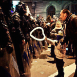 19.-Bucharest-Romania-2012-A-young-boy-offers-a-heart-shaped-baloon-to-police.-1.png