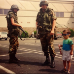 2.-Los-Andeles-USA-1992-A-child-poses-beside-National-Guard-members-during-The-LA-Riots.png