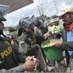 6.-Columbia-2013-Protestors-share-crackers-with-colombian-riot-police_thumb.png