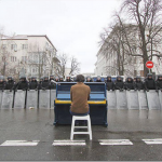 7.-Kiev-Ukraine-2013-Man-playing-piano-for-police_thumb.png