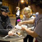 9.-London-England-2011-Caring-citizens-offer-tea-to-British-riot-police.png