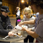 9.-London-England-2011-Caring-citizens-offer-tea-to-British-riot-police_thumb.png