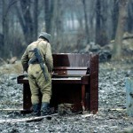 A-Russian-soldier-playing-an-abandoned-piano-in-Chechnya-in-1994.jpg