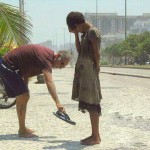 This-photograph-of-a-man-giving-his-shoes-to-a-homeless-girl-in-Rio-de-Janeiro.jpg