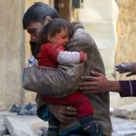 A boy rescues his sister from Syrian rubble.