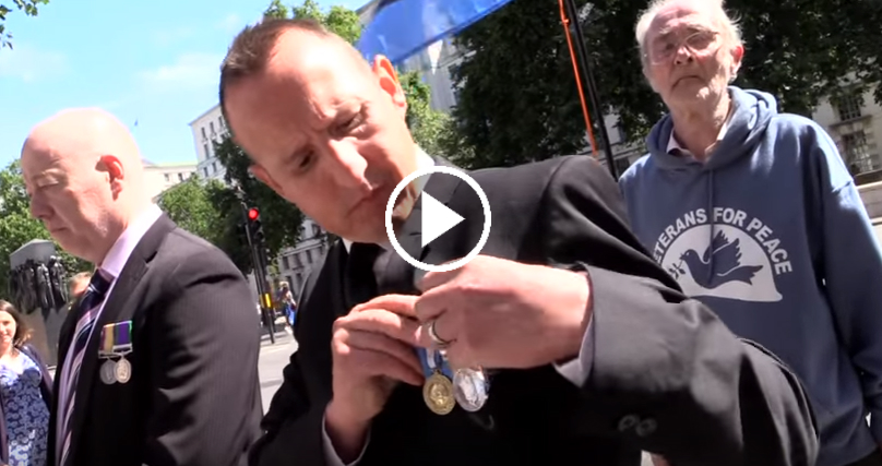 Moment British Soldiers Throw Their Medals